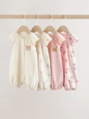 pink character all over printed button through jersey baby rompers 4 pack